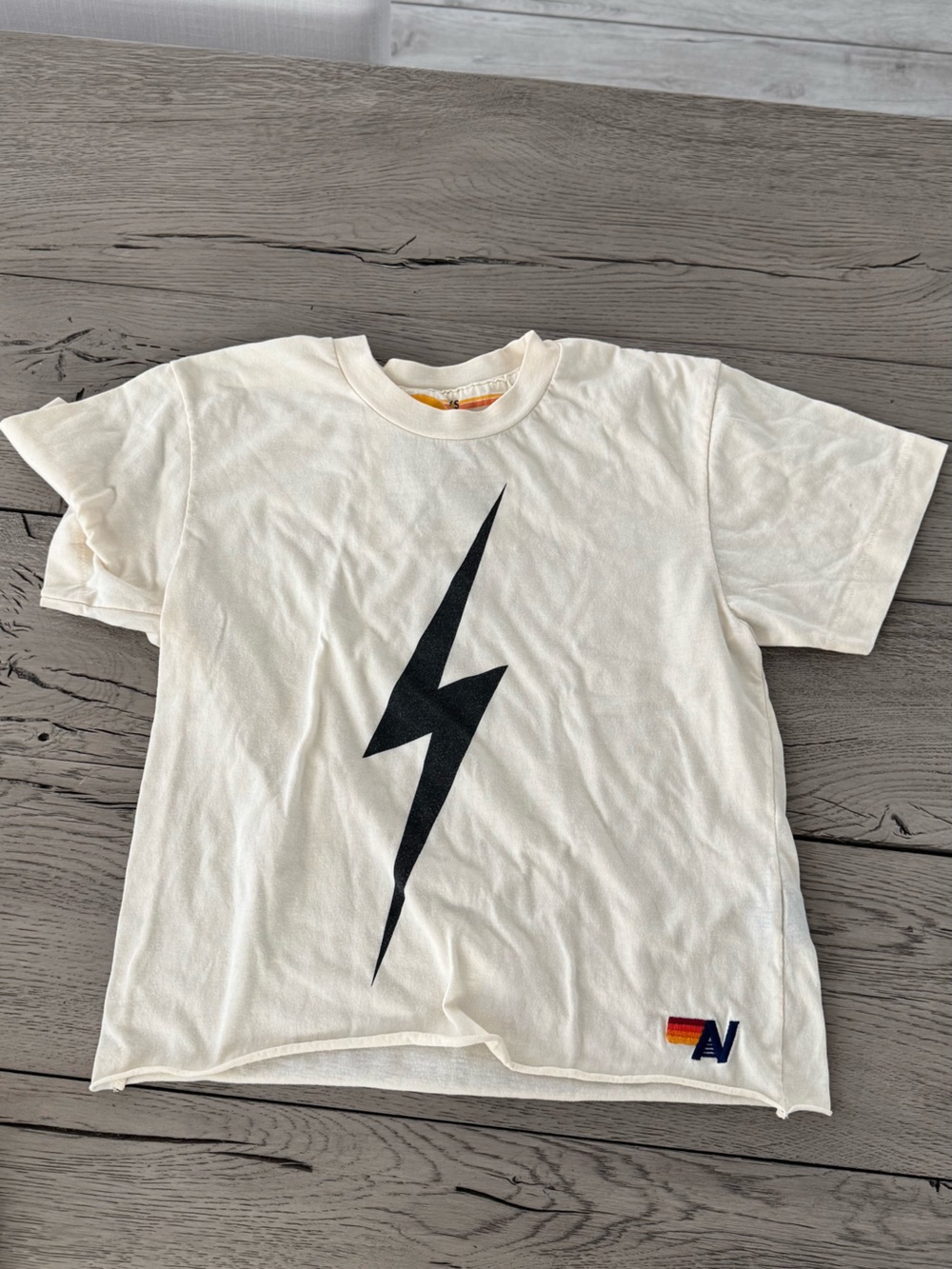 Aviator Nation Cream Tee with Black Lightning Bolt